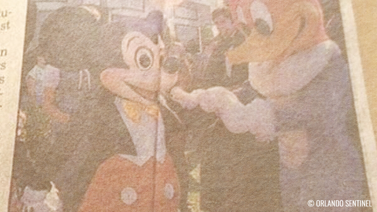 Woody Woodpecker from Universal Studios Delivers Gift to Mickey Mouse at Walt Disney World