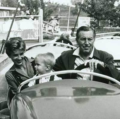 Diane Disney Miller, Christopher Disney Miller and Walt take a spin on Disneyland's Autopia. Copyright Disney Enterprises, Inc. All rights reserved