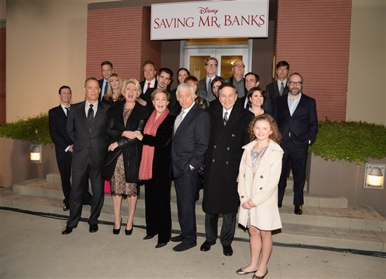 Cast of Saving Mr. Banks poses on the steps of the animation building at Walt Disney Studios