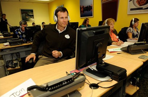 Tom Staggs wearing headphones at the Disney Reservation Center