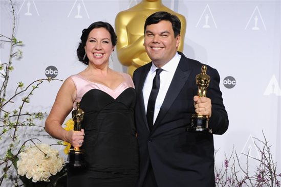 Kristen Anderson-Lopez and Robert Lopez celebrate their 2014 Oscar win for Let it Go from the Disney movie Frozen